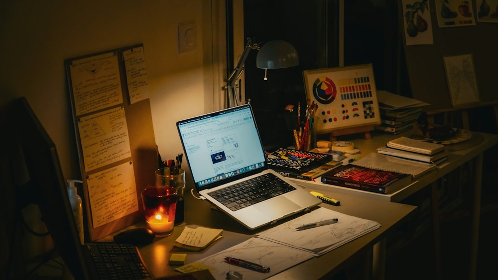 Laptop and books on a study desk for comparing original and translated research
